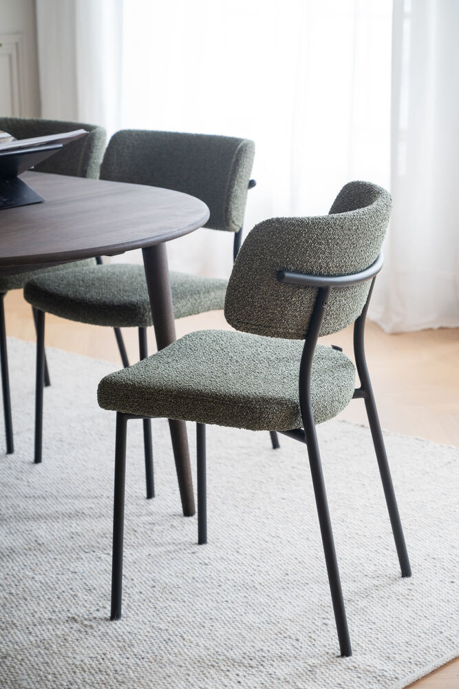 Herbster spisebordsstol i grønt stof med sorte ben